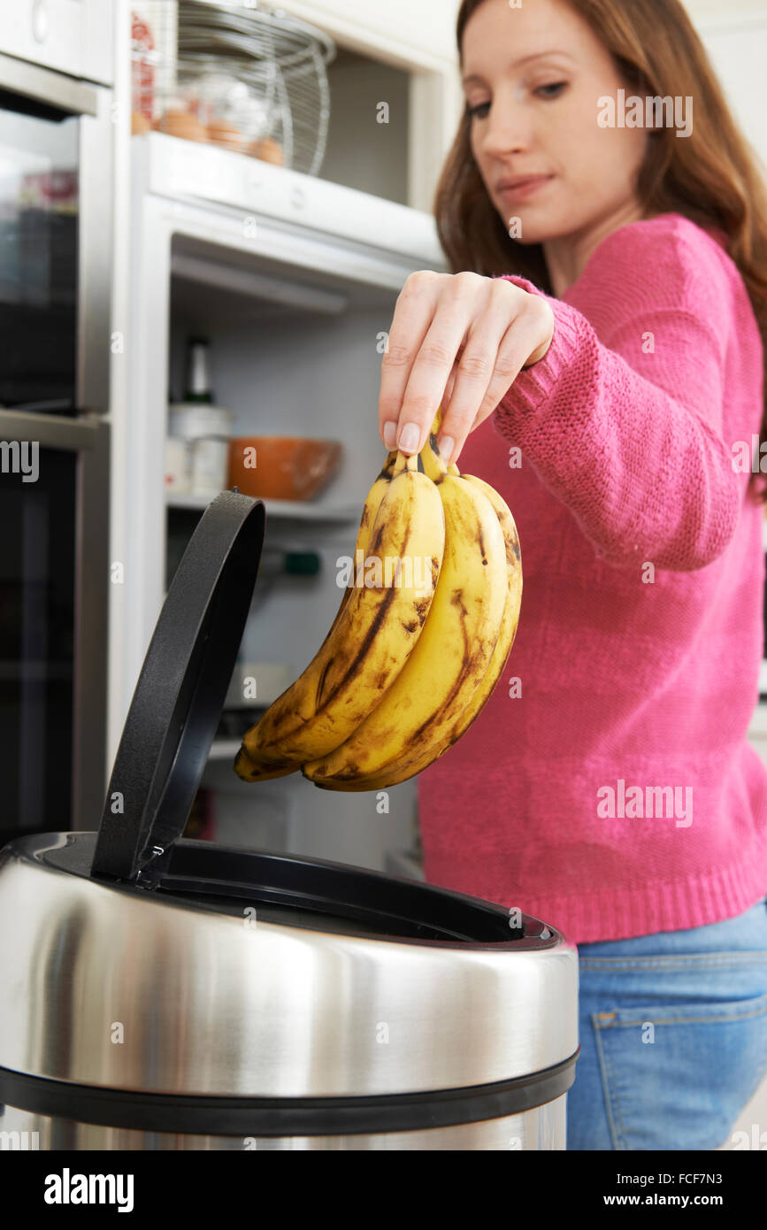 Woman Throwing Away Out Of Date Food In Refrigerator Stock Photo Alamy