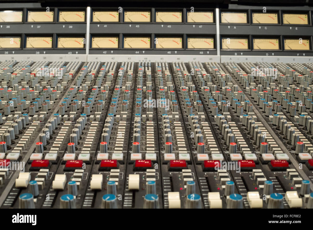 ssl e series sound mixing desk showing buttons, knobs and controls Stock Photo