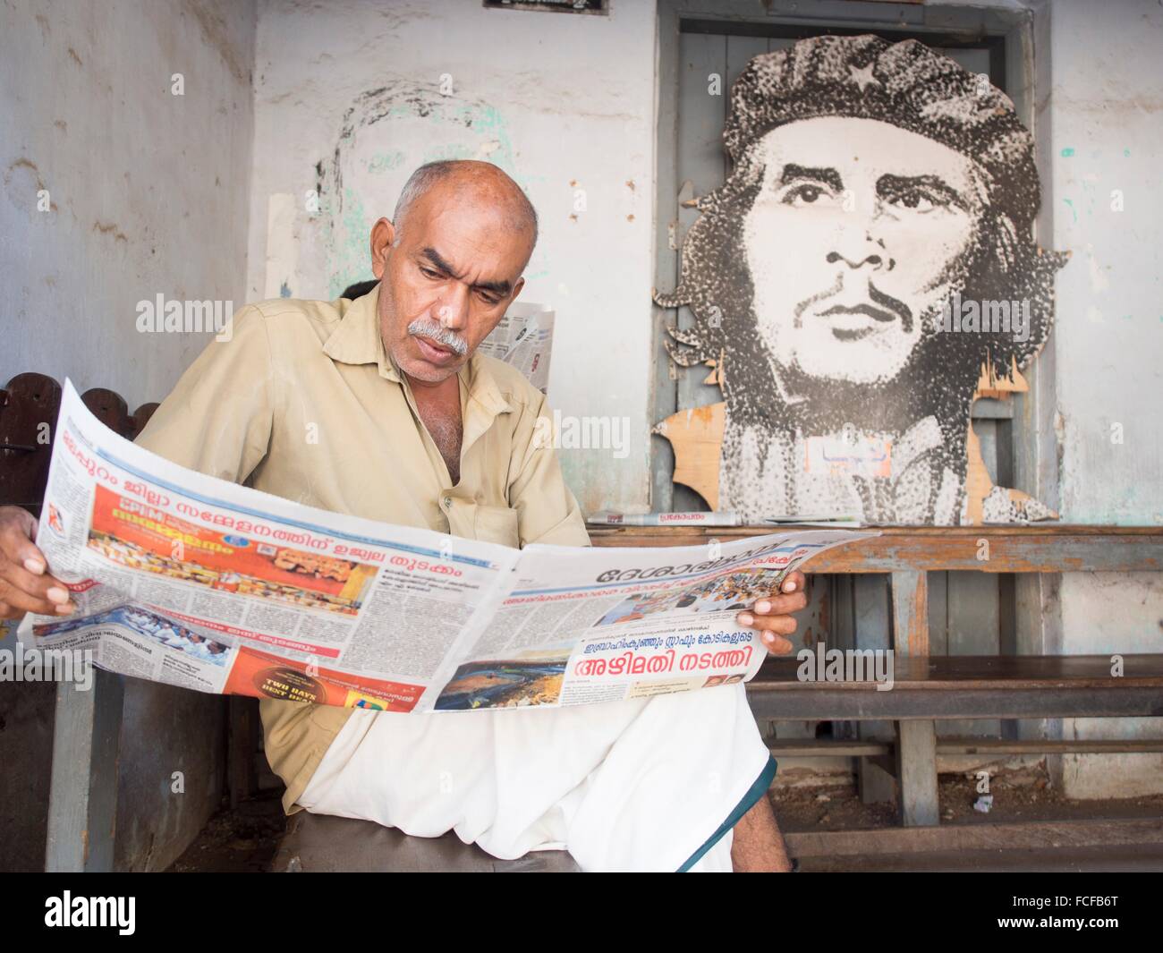 Man reading newspaper, Cochin, Kerala, India Stock Photo Alamy