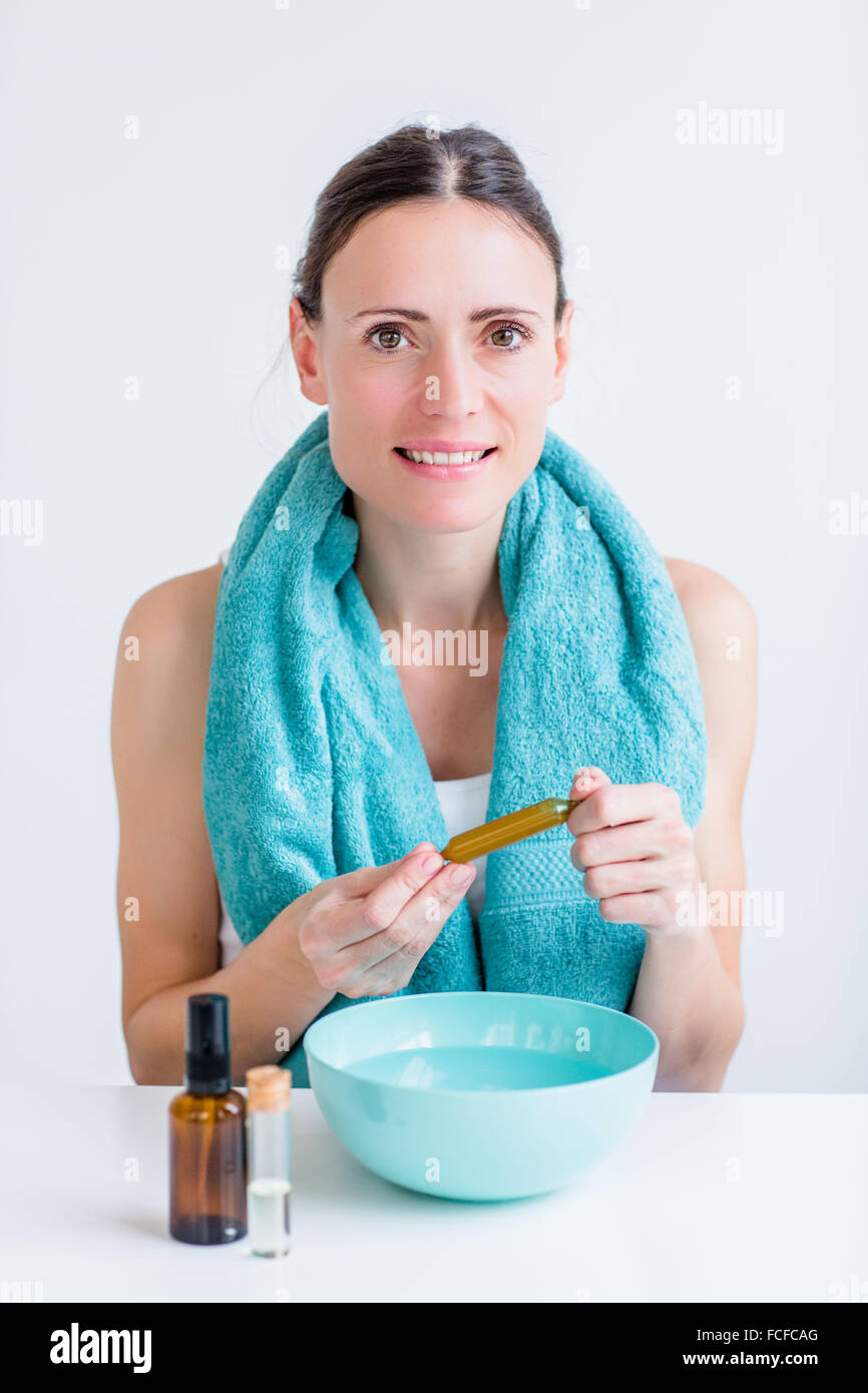 Woman treating a nasal congestion with an inhalation. Stock Photo