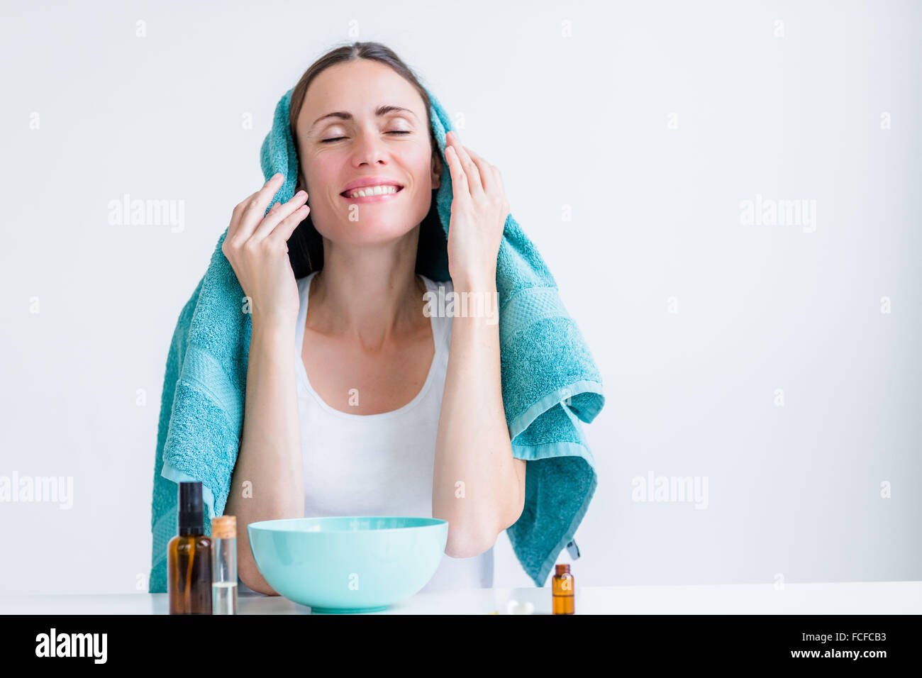 Woman treating a nasal congestion with an inhalation. Stock Photo