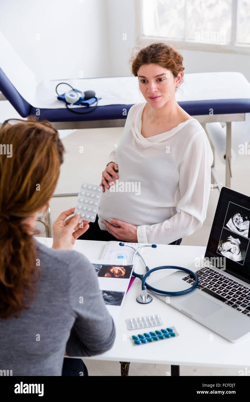 Pregnant woman in consultation with a gynecologist Stock Photo - Alamy