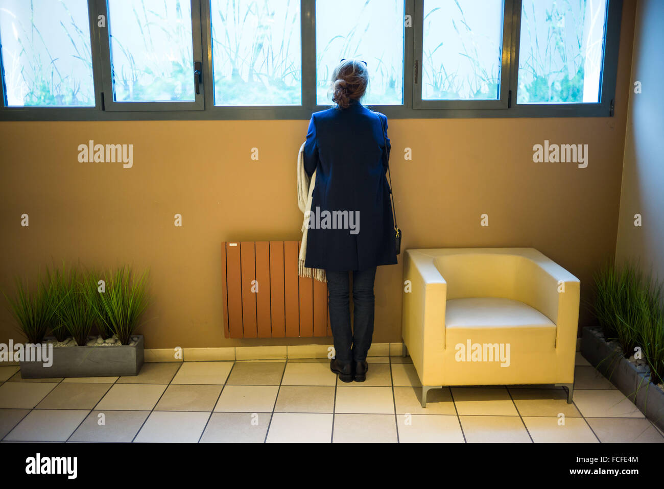 Woman in a funeral home . Stock Photo