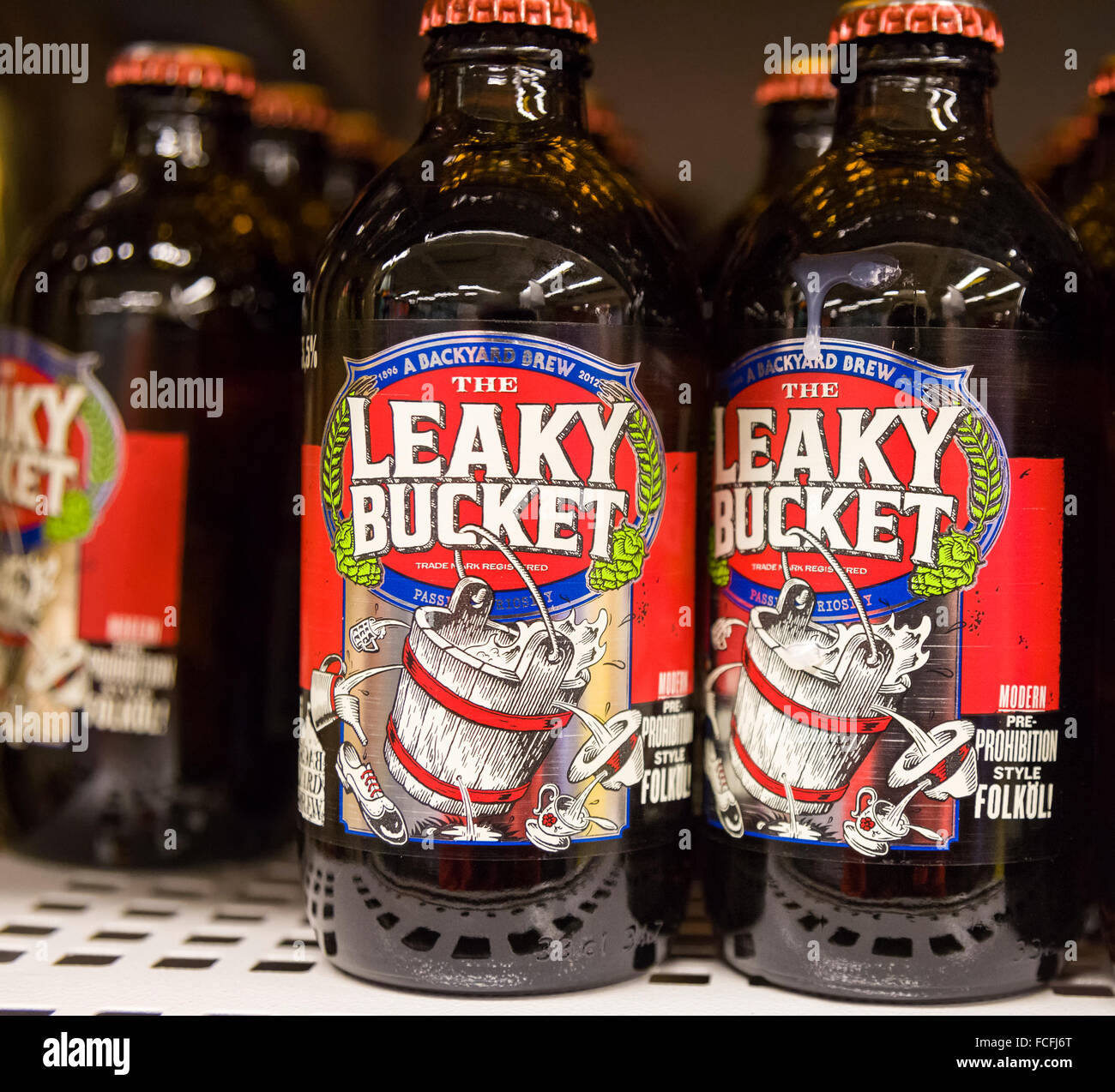 The Leaky Bucket bottle of beer / lager  Model Release: No.  Property Release: No. Stock Photo