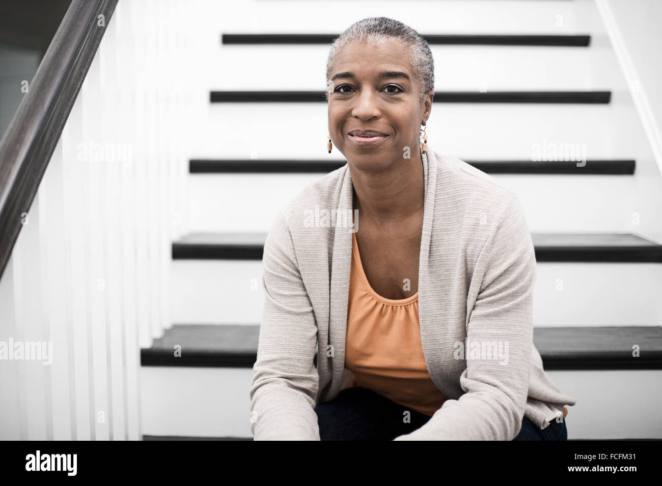 Mature woman sitting hallway hi-res stock photography and images - Alamy