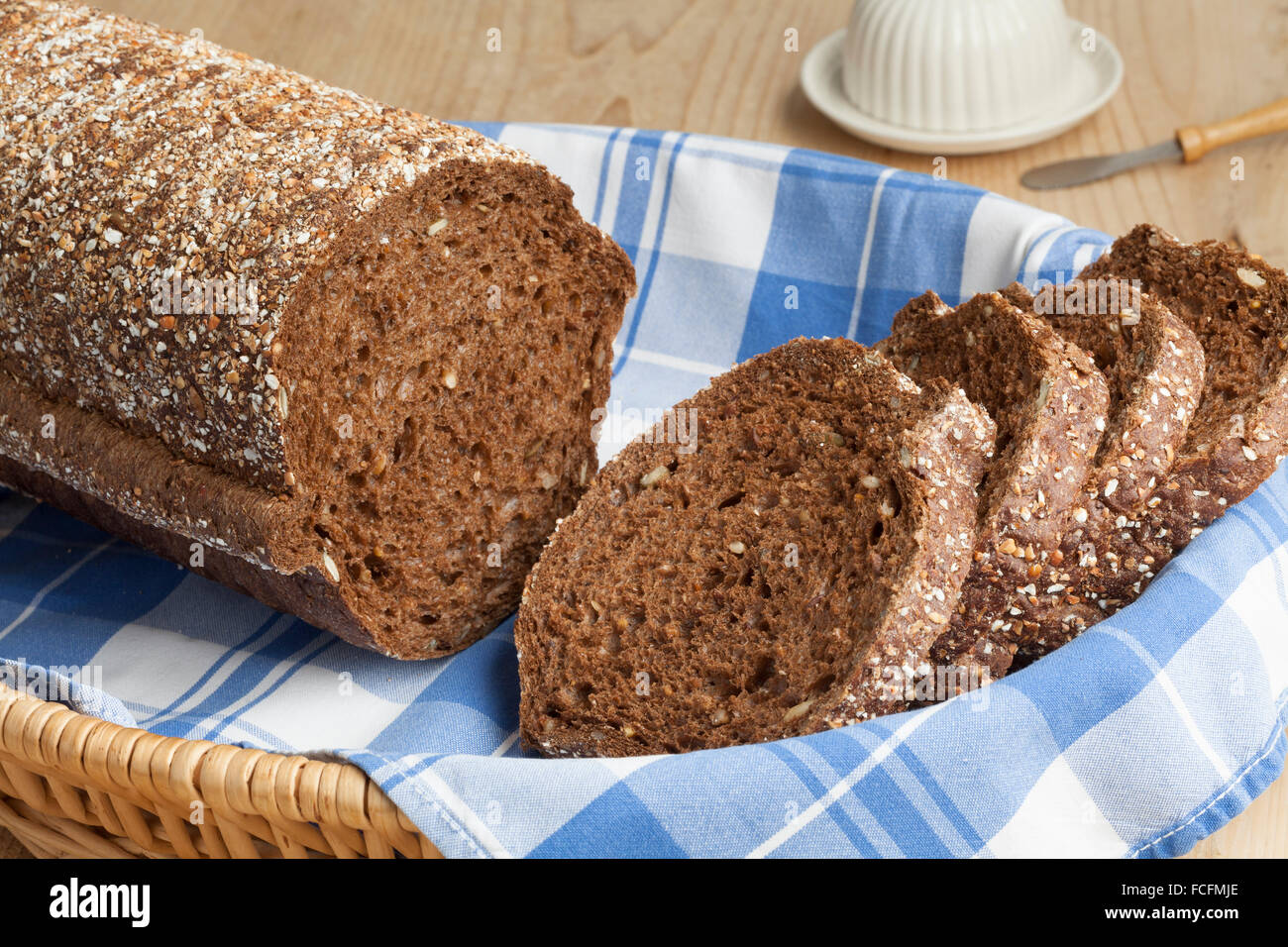 Fresh round multigrain bread in a basket Stock Photo