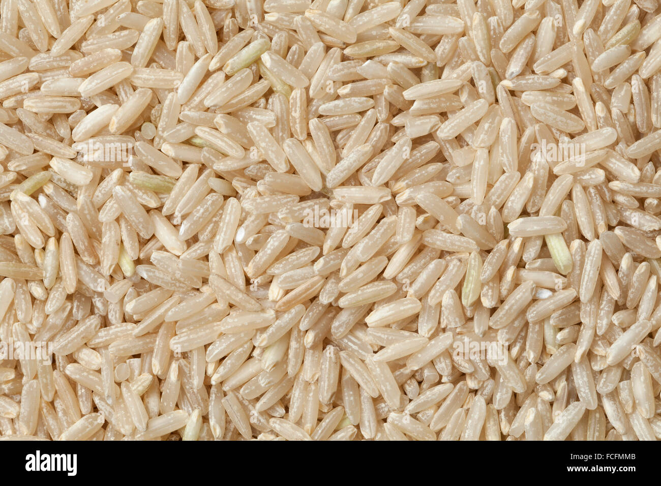 Raw brown rice full frame Stock Photo - Alamy