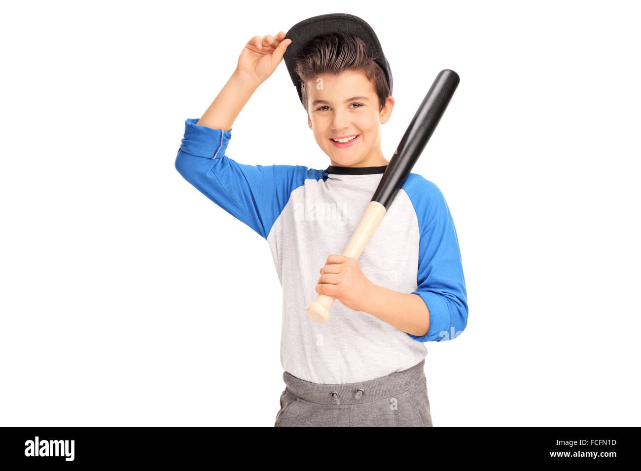 Little boy holding a baseball bat and looking at the camera isolated on white background Stock Photo