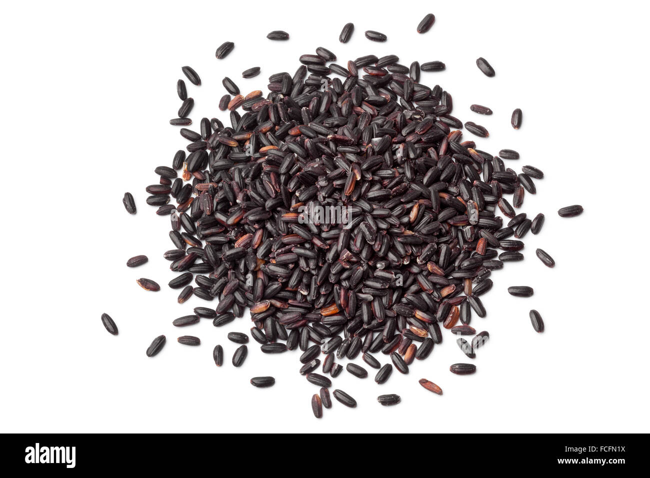 Heap of raw black venere rice on white background Stock Photo