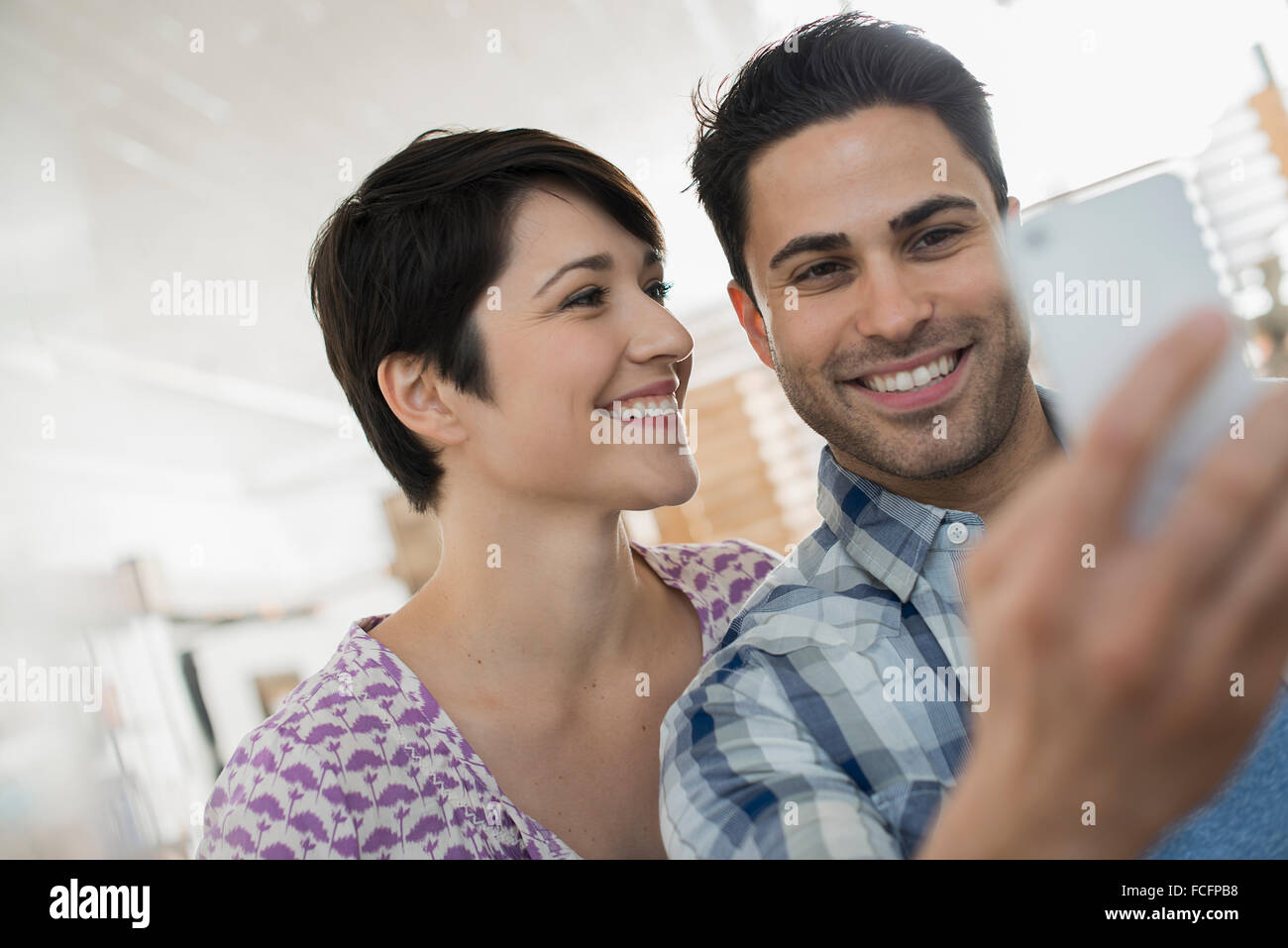 A couple, man and woman posing for a selfy. Stock Photo