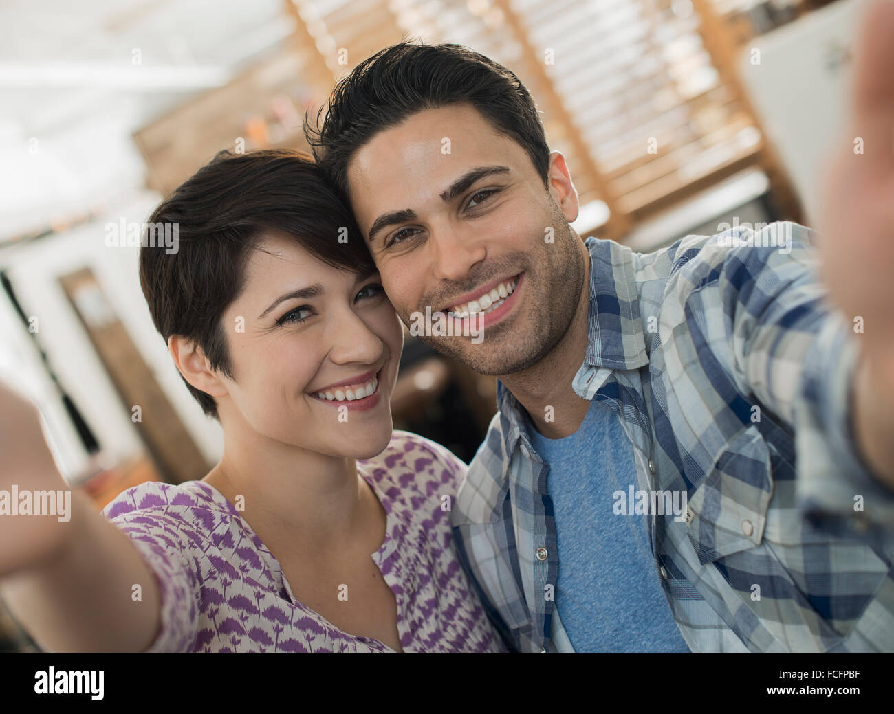 A couple, man and woman posing for a selfy. Stock Photo