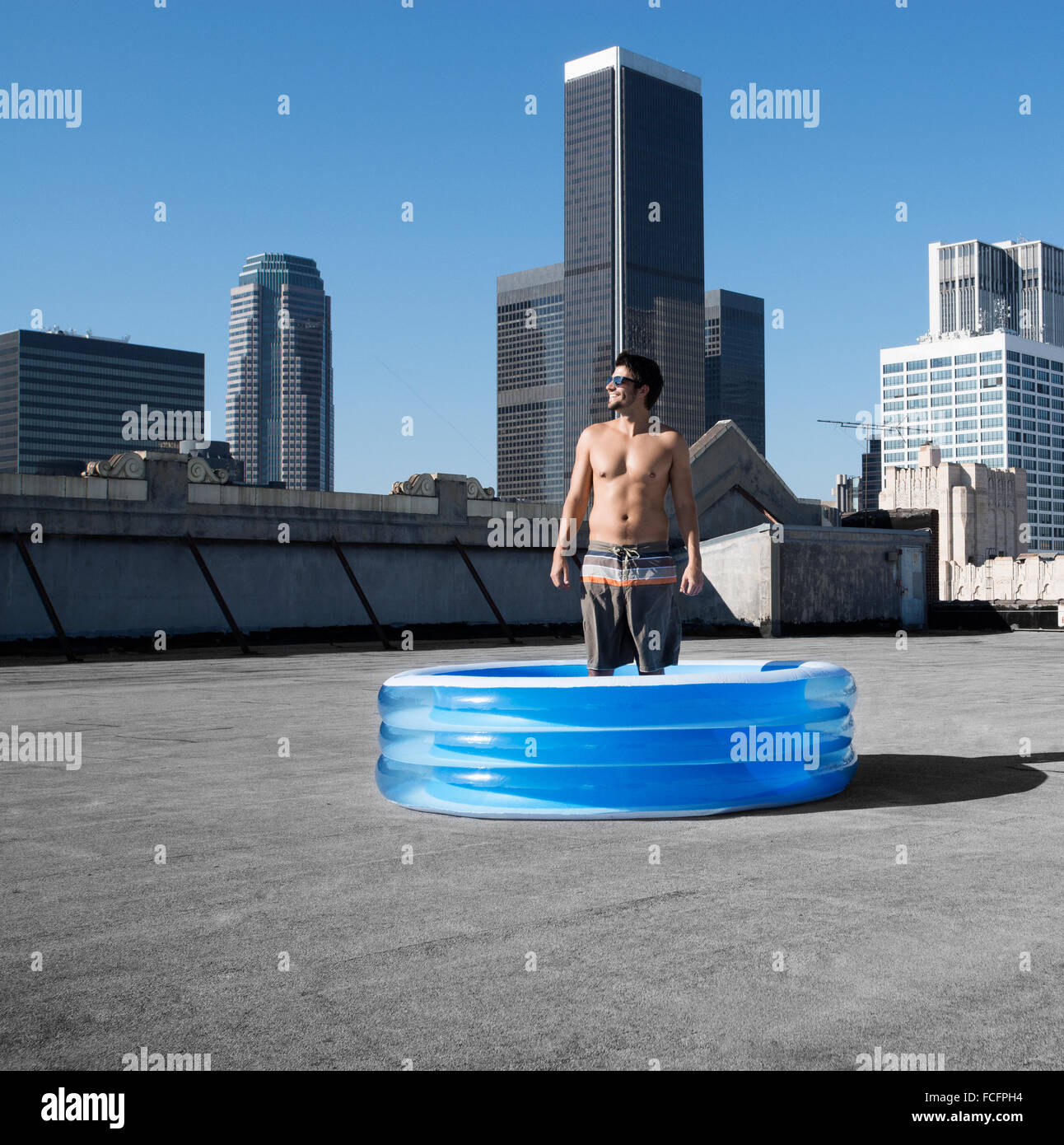 a-man-standing-in-a-small-inflatable-wat