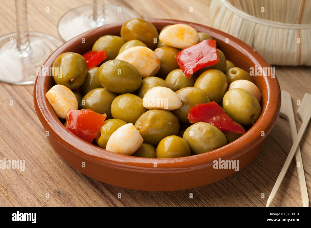 Marinated green olives and garlic as a snack Stock Photo Alamy