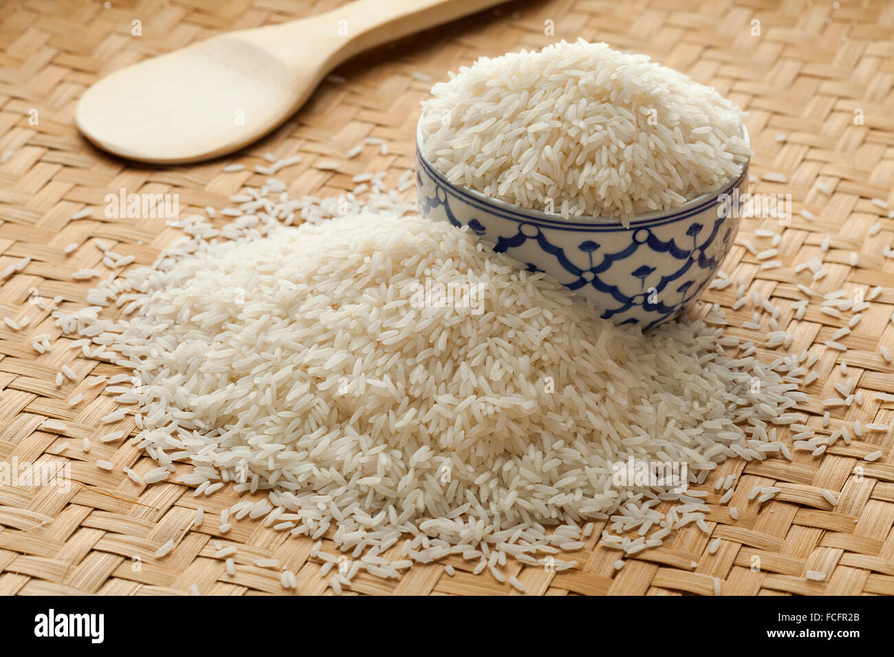 Bowl with uncooked white Jasmine rice Stock Photo