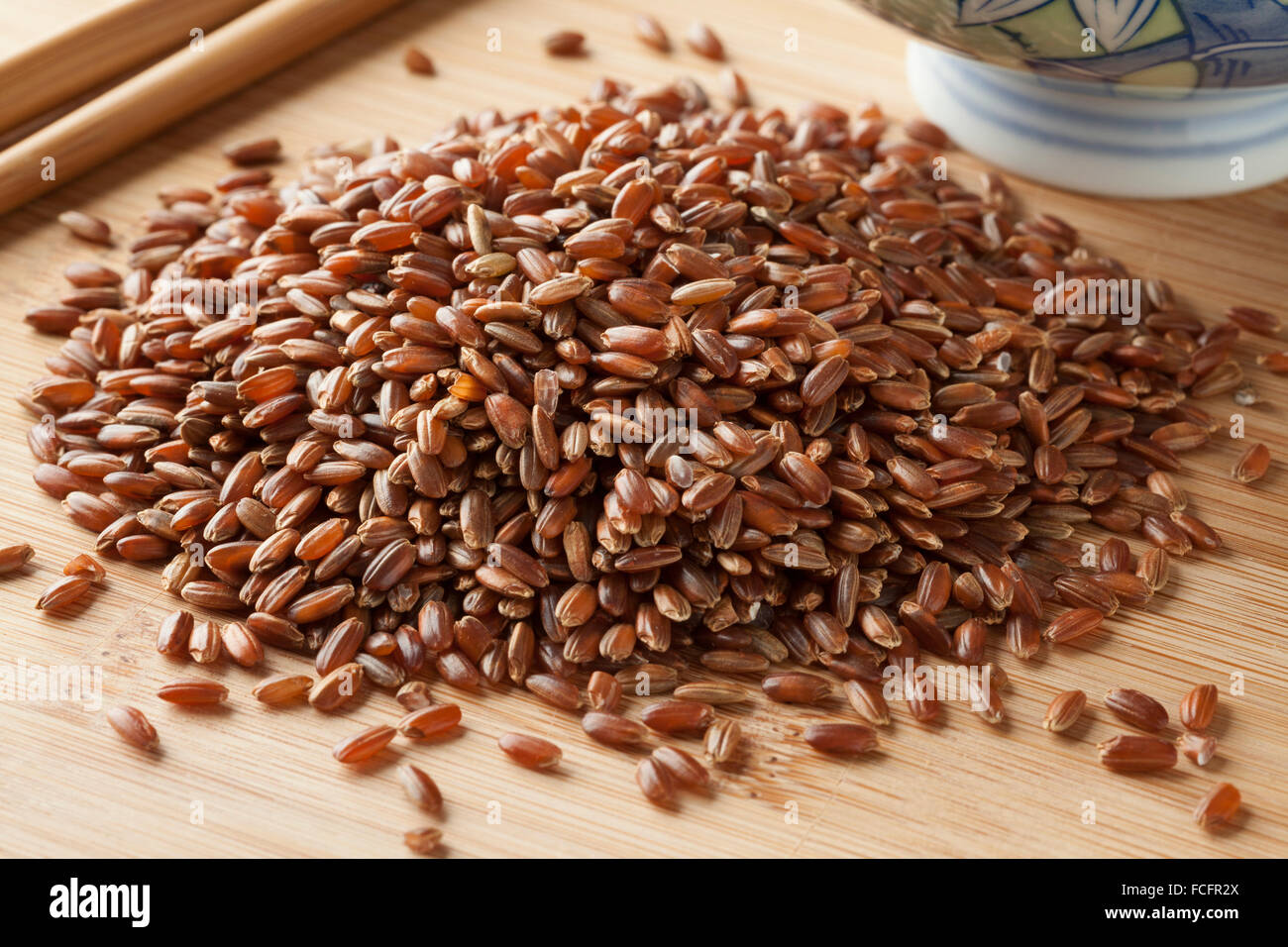 Heap of raw red rice ready to cook Stock Photo