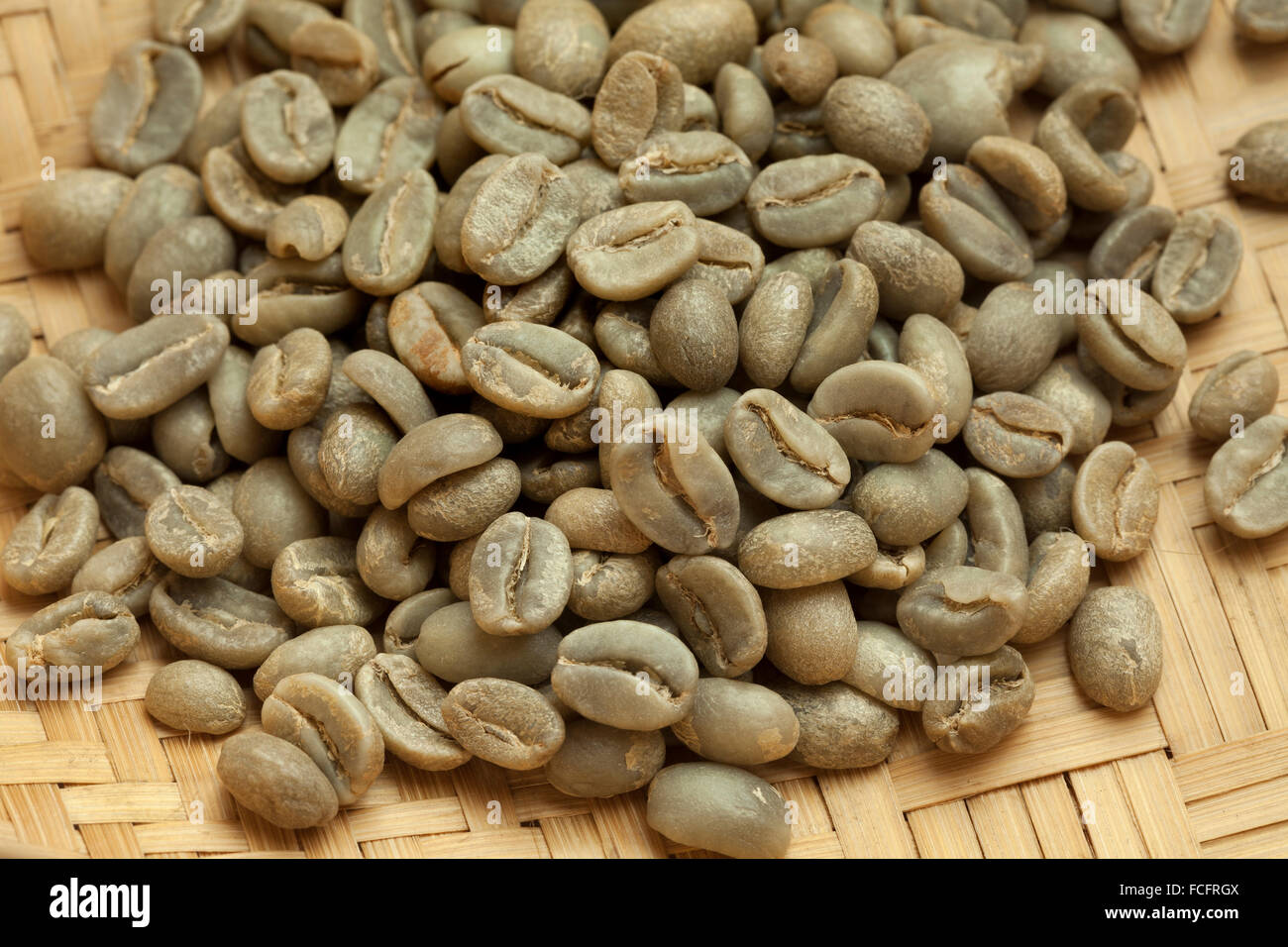Heap of Bolivian Yanaloma green unroasted coffee beans close up Stock Photo