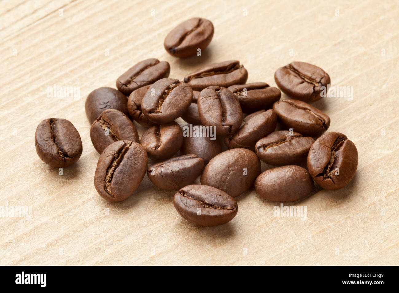 Heap of roasted  Malabar coffee beans from India Stock Photo