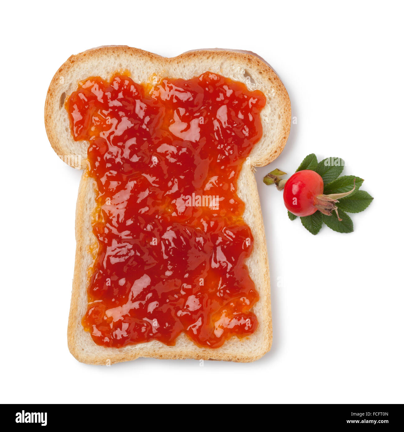 Slice of bread with jam of rose hips on white background Stock Photo