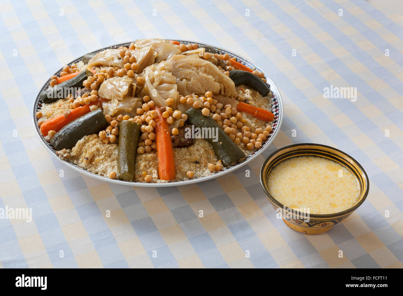 Traditional Moroccan couscous with buttermilk sauce in a bowl Stock