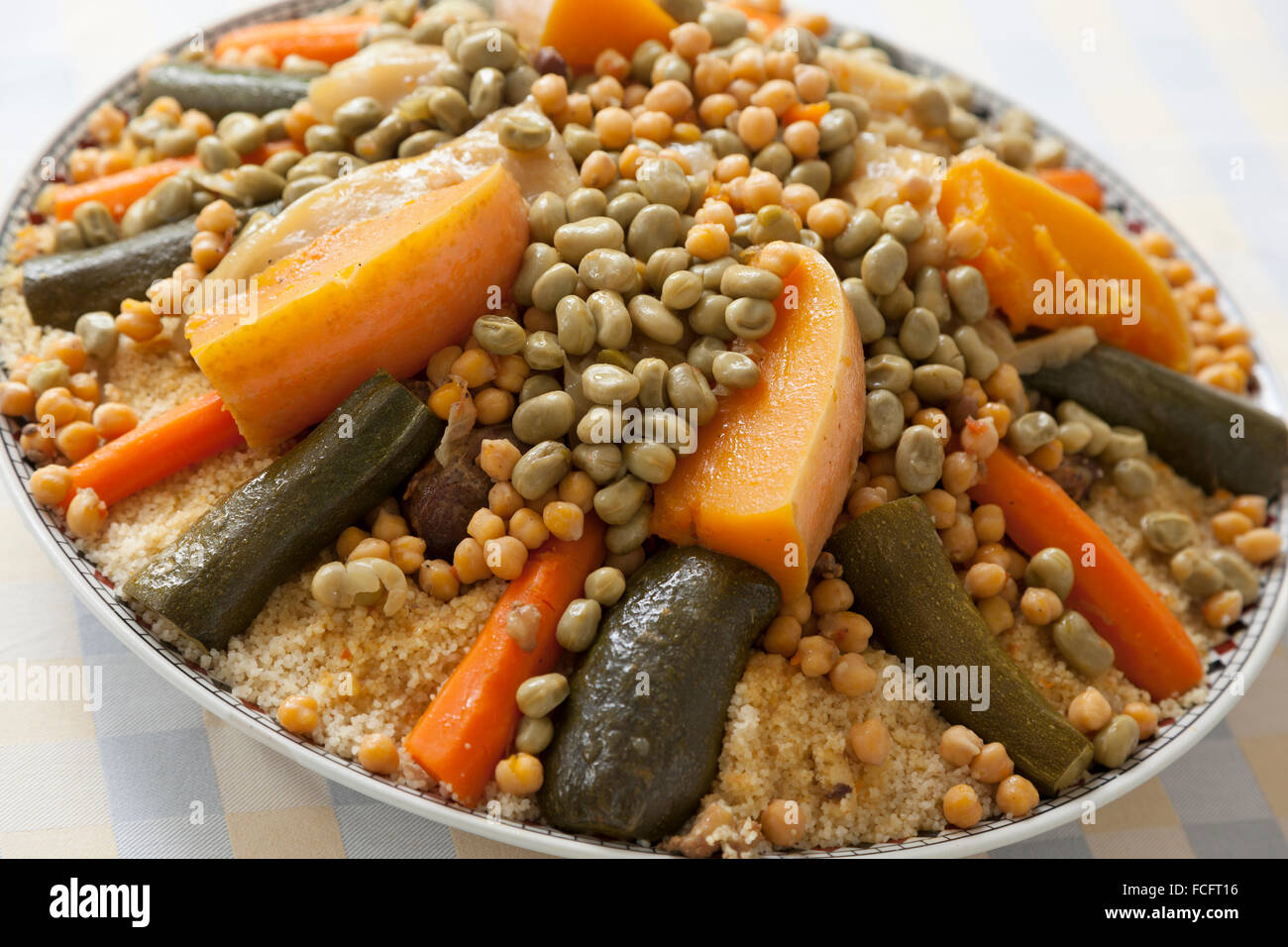 Festive Moroccan couscous with broad beans on a dish Stock Photo - Alamy