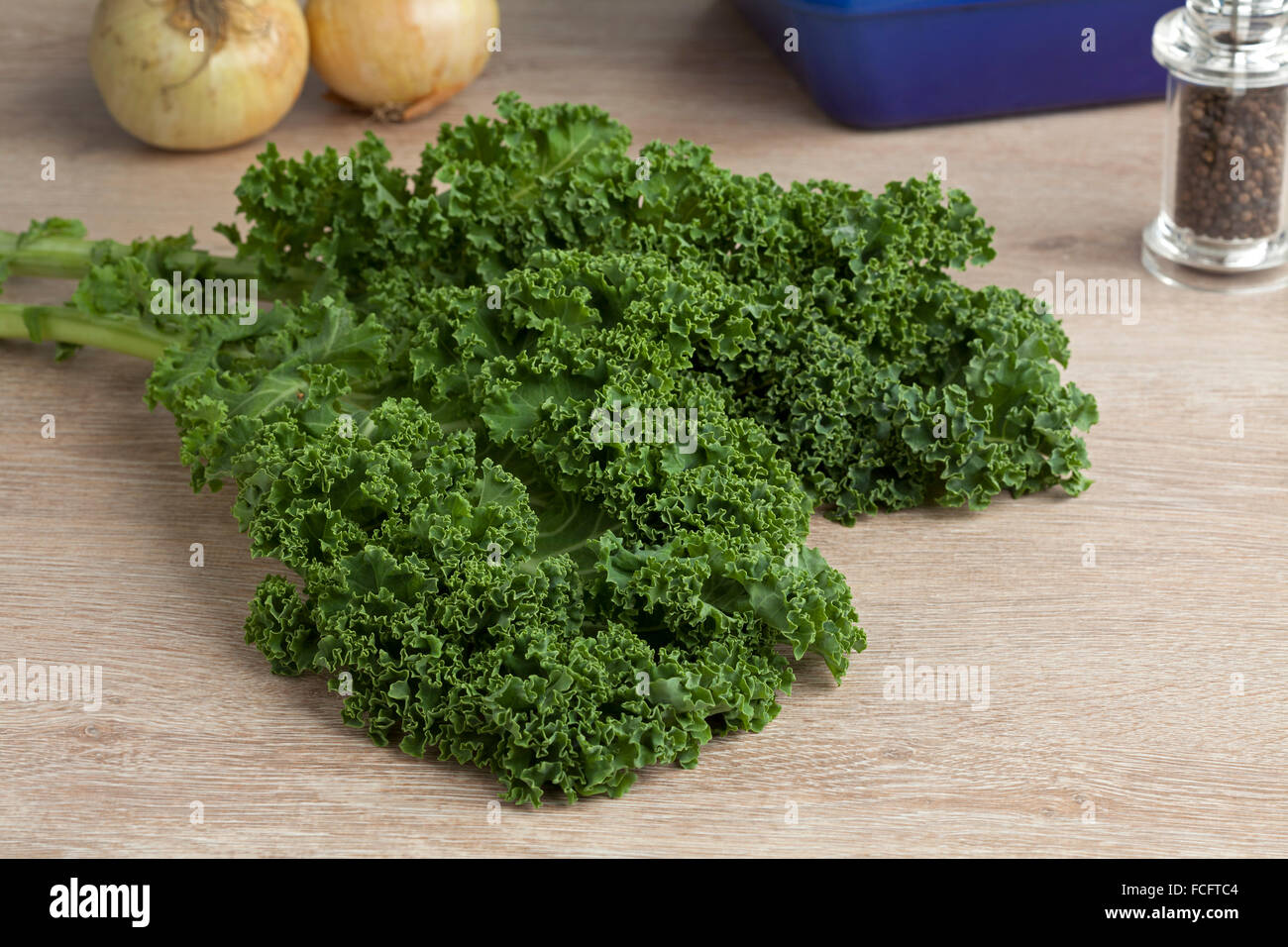 Fresh picked organic curly kale leaves on the table Stock Photo