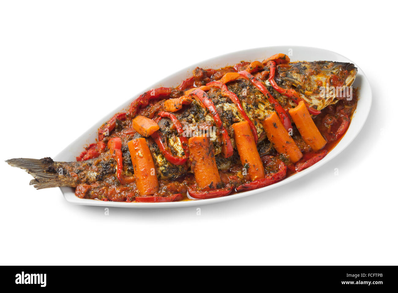 Moroccan fish tagine with chermoula on white background Stock Photo Alamy