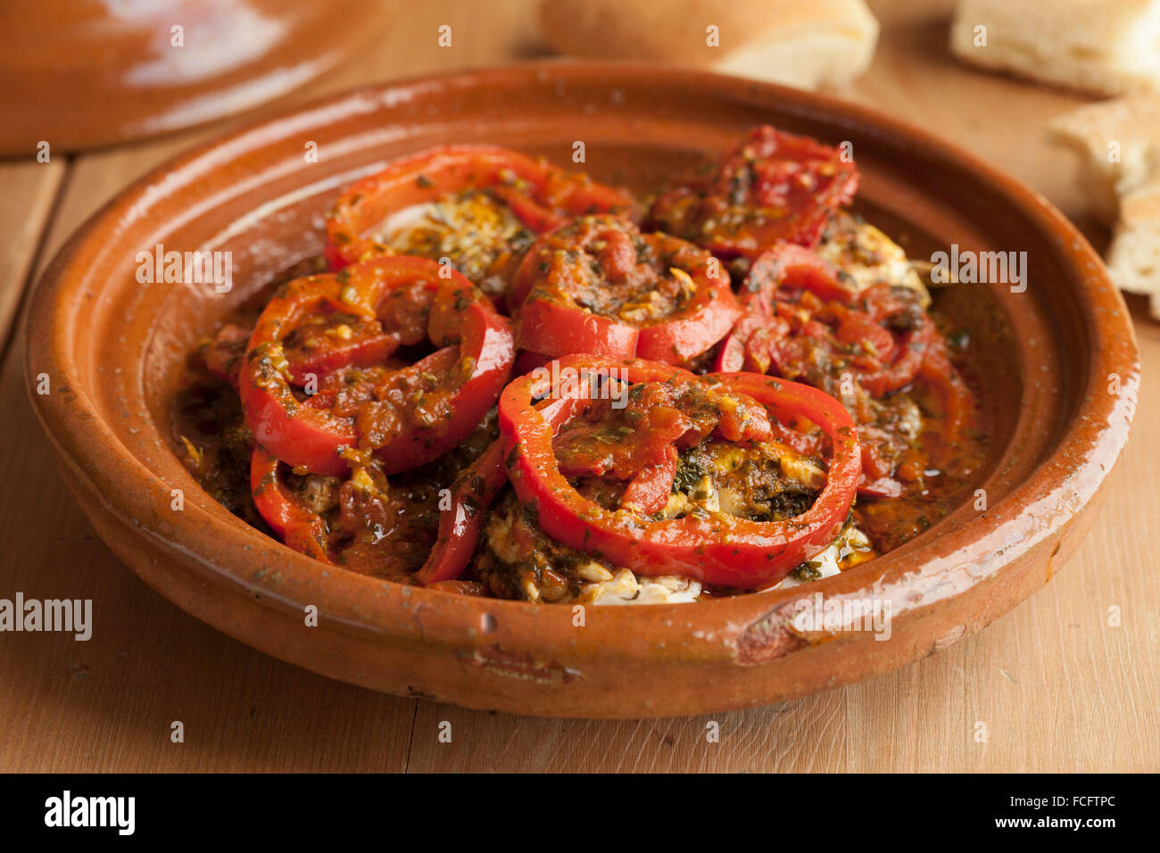 Moroccan fish tagine with chermoula and red peppers Stock Photo Alamy