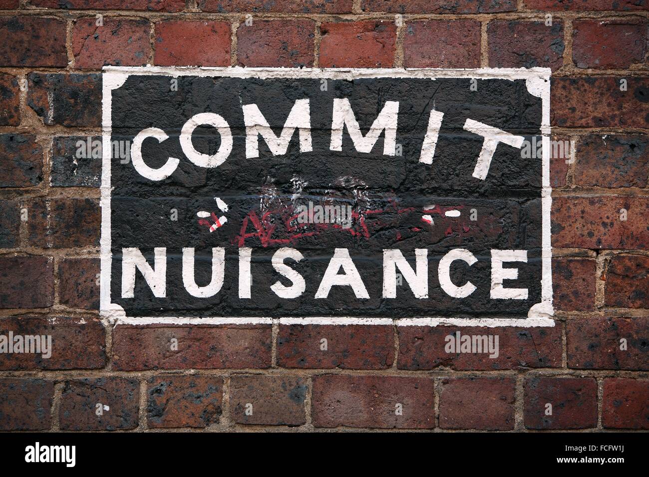 Commit no nuisance sign in laneway in Melbournes Chinatown. Victoria, Australia. Stock Photo
