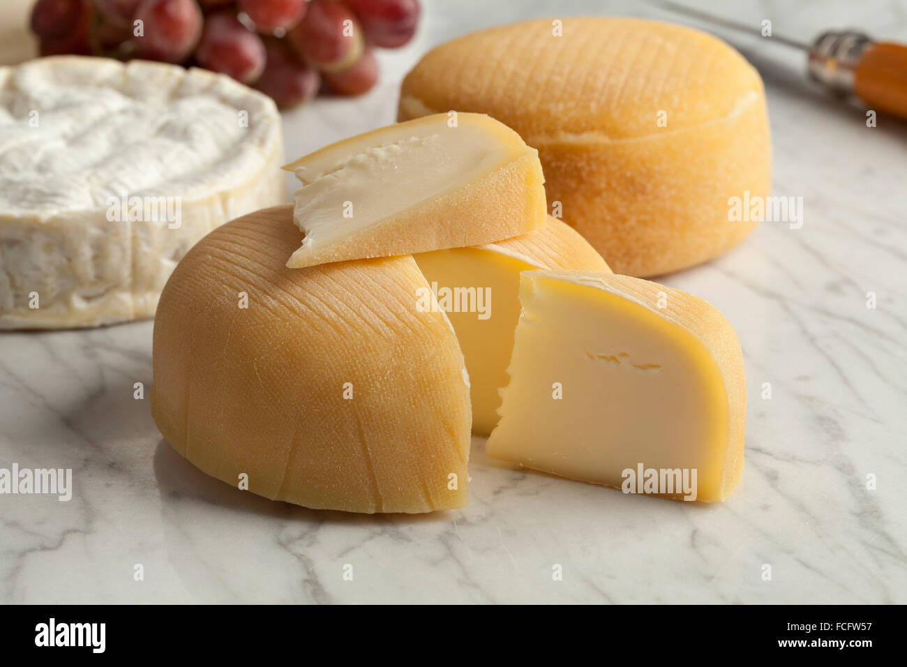 French cheese platter with camembert, chaussee aux moines and grapes as dessert Stock Photo