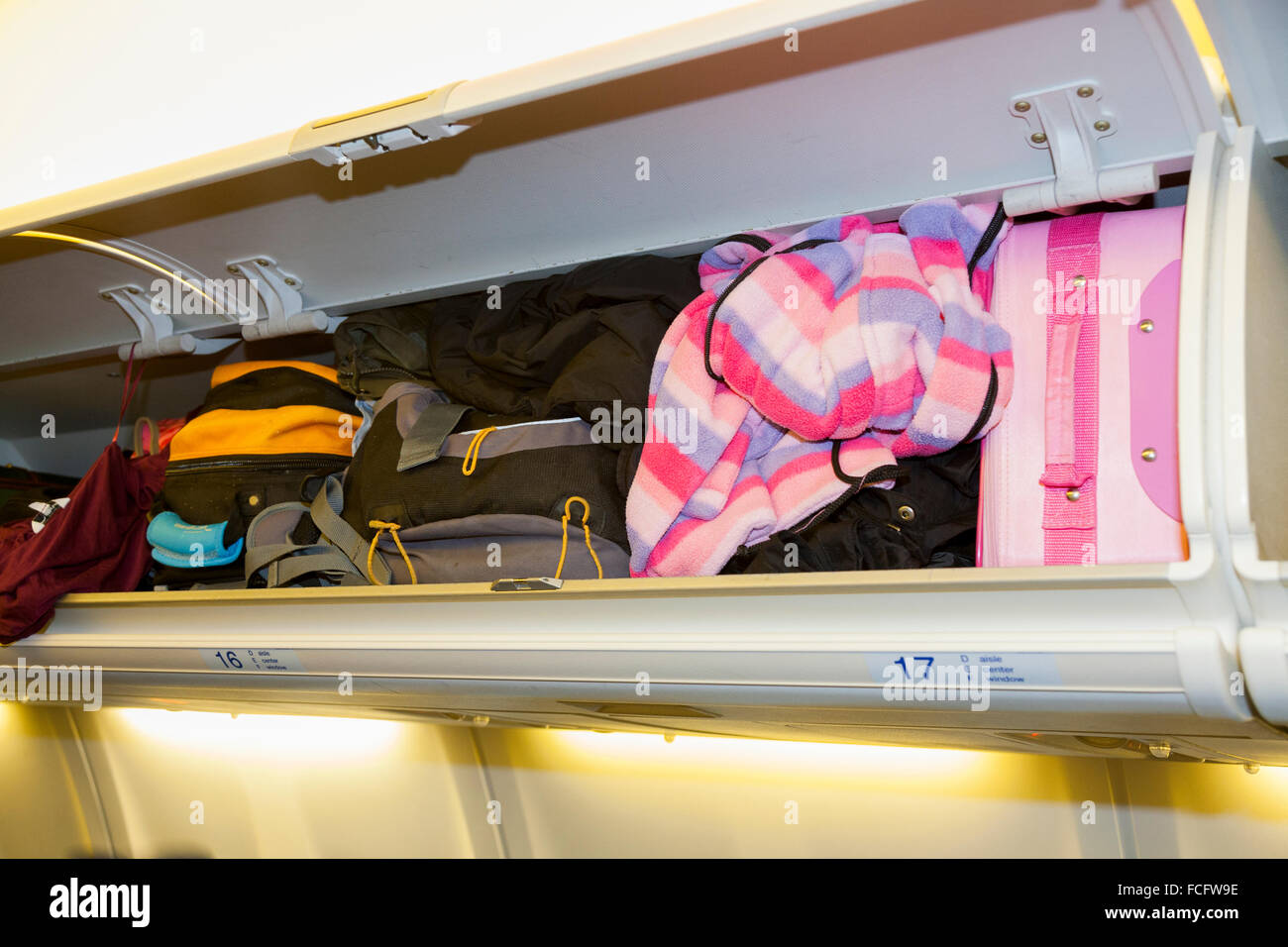 Overhead passenger locker / lockers / compartment / compartments for stowing passengers bags cabin luggage baggage. KLM Airbus aircraft Stock Photo