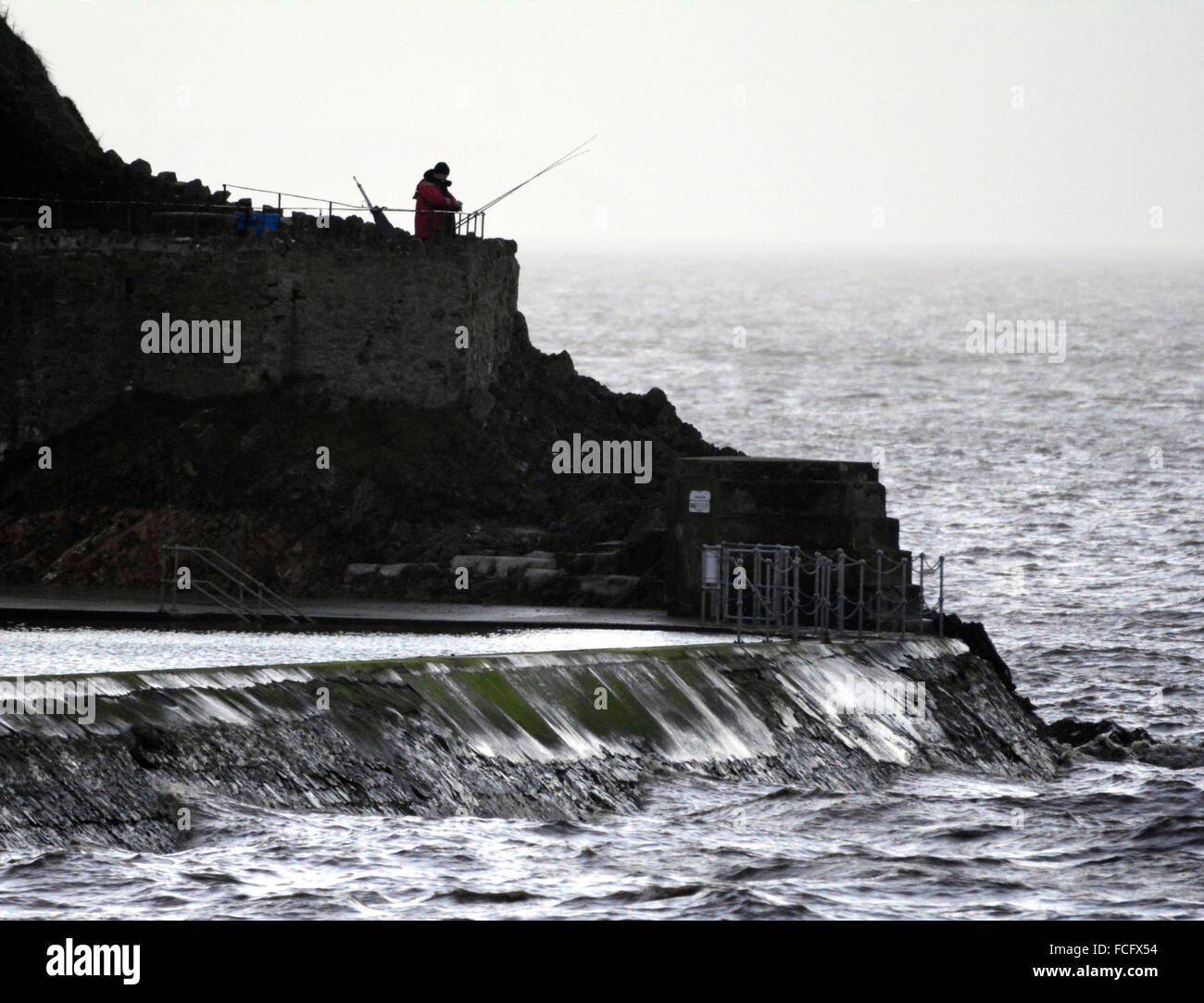 Clevedon, UK. 22nd January, 2016. UK Weather. A nice way to end the day sea fishing at Clevedon sea front. Credit:  Robert Timoney/Alamy Live News Stock Photo