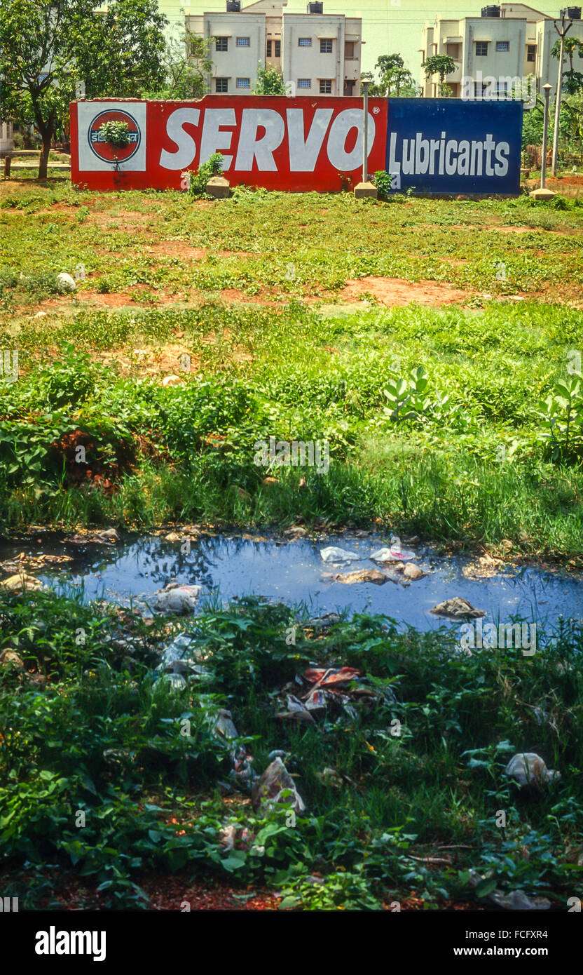 A large billboard advertising Servo Lubricants in a rural location in Tamil Nadu, India Stock