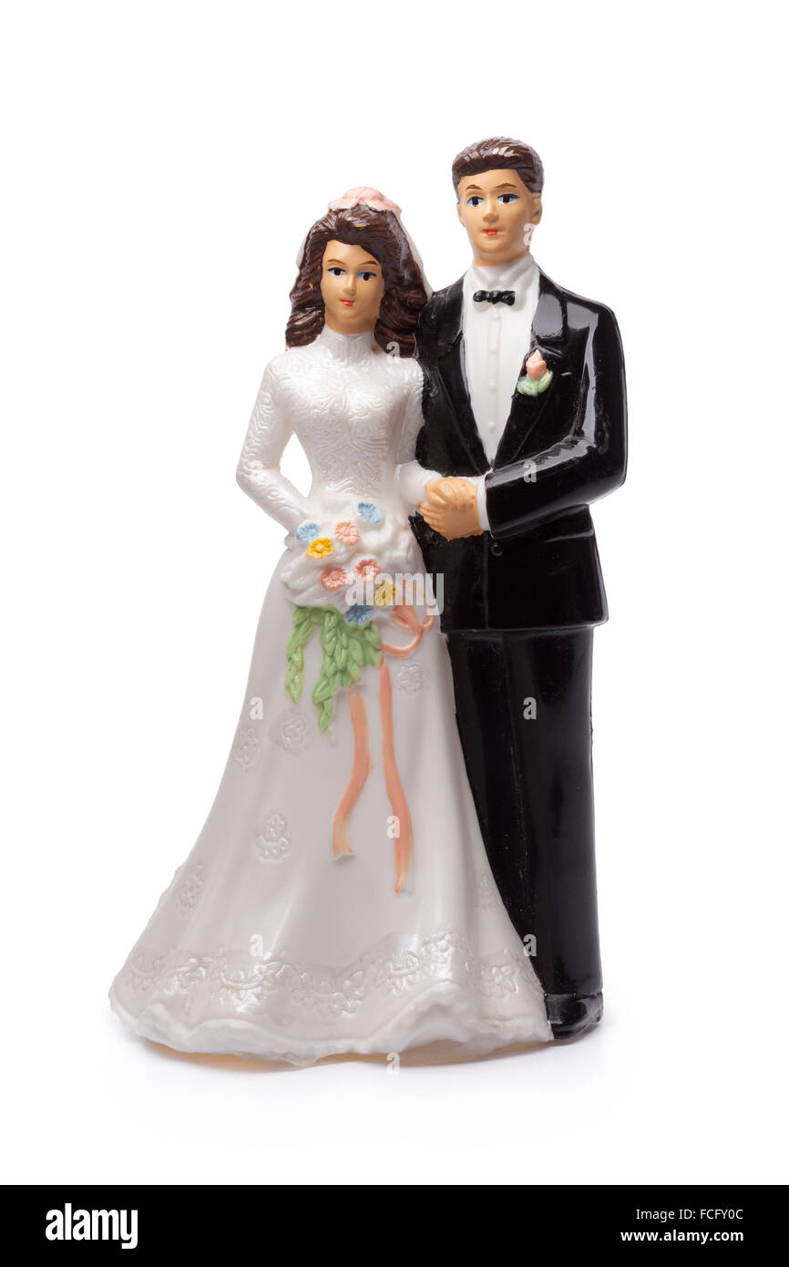 Bride and groom, old cake topper on white background Stock Photo