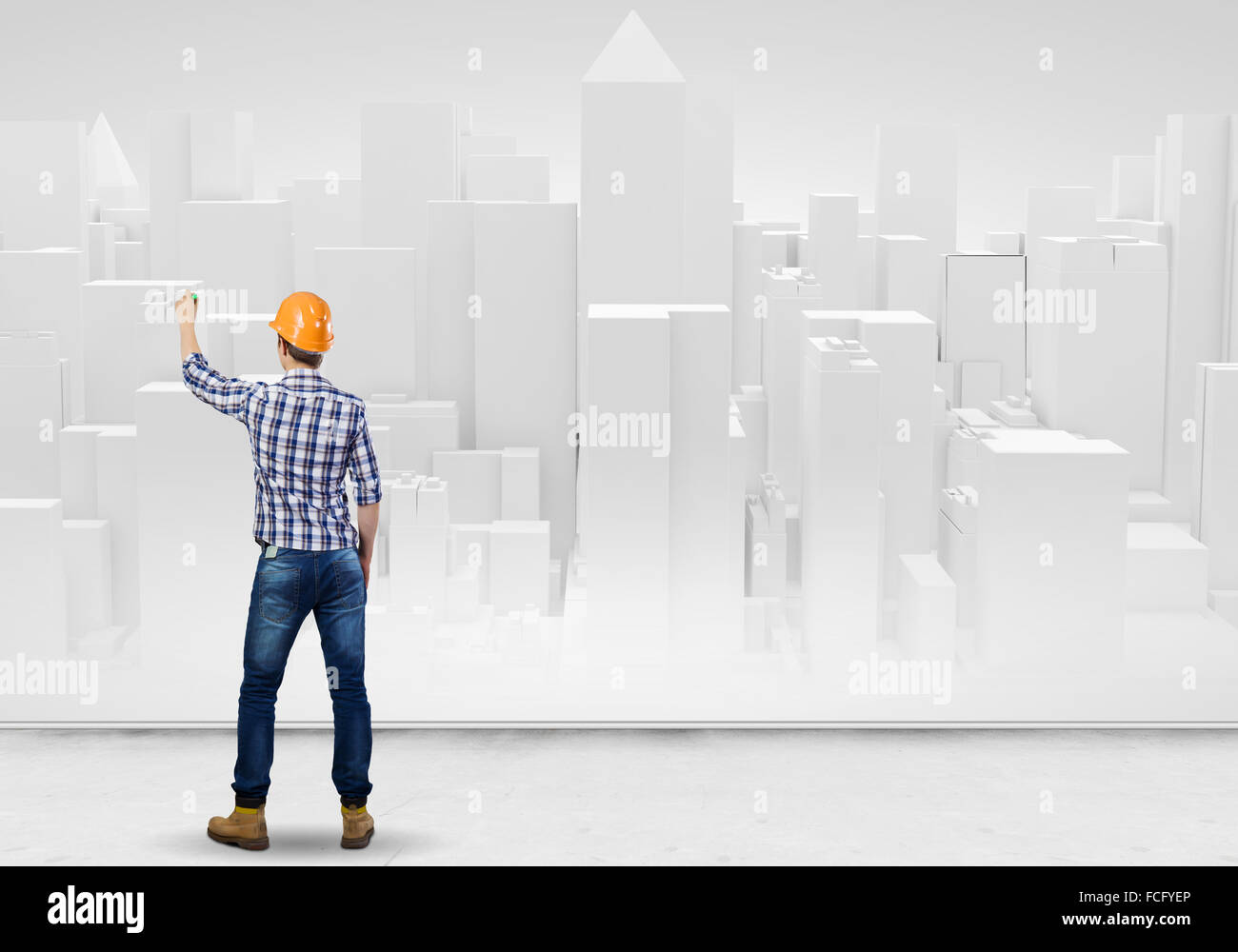 Rear view of engineer drawing project of business district Stock Photo ...