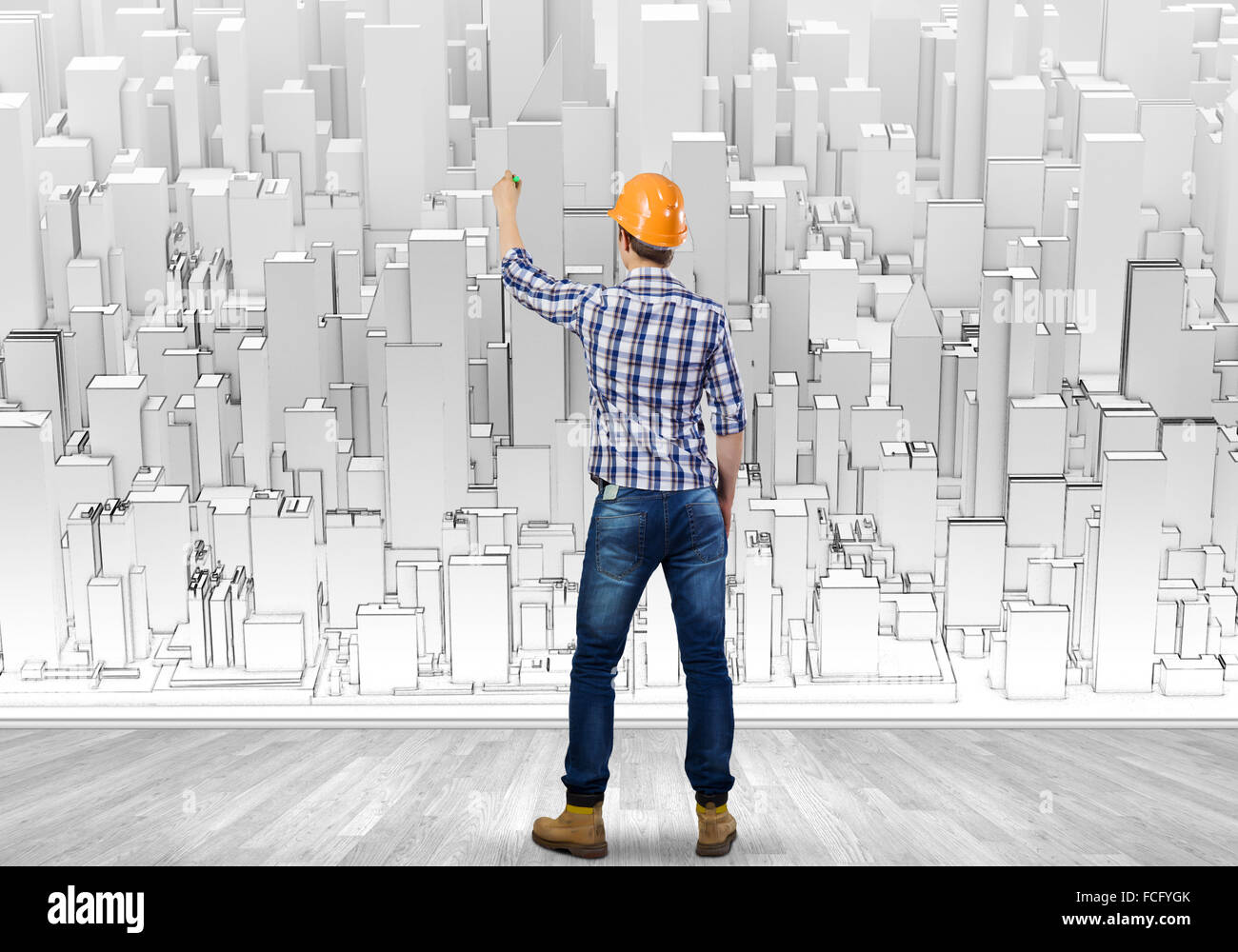 Rear view of engineer drawing project of business district Stock Photo ...