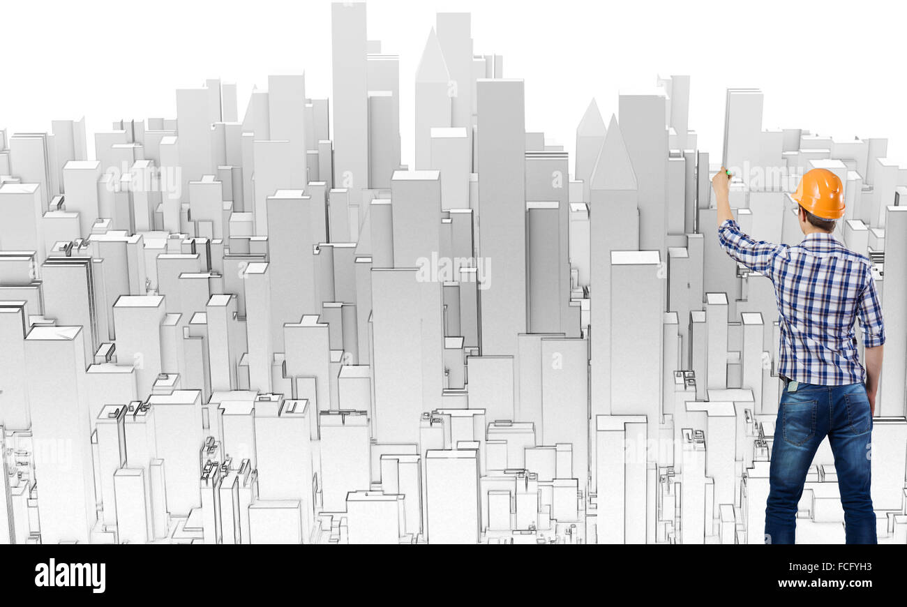 Rear view of engineer drawing project of business district Stock Photo ...