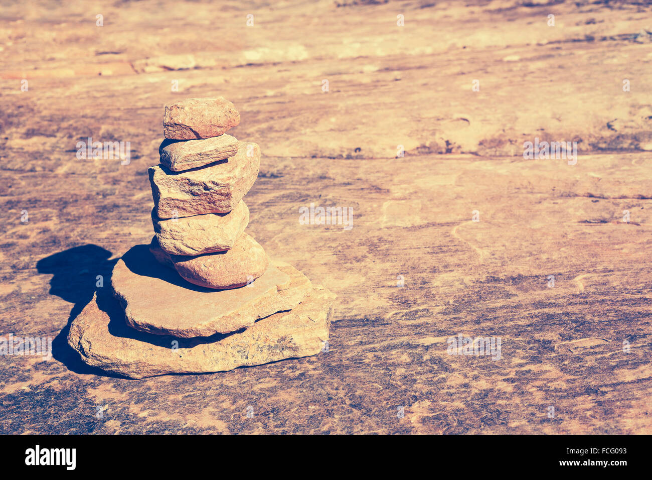 Vintage toned stone pyramid symbolizing harmony and balance. Stock Photo