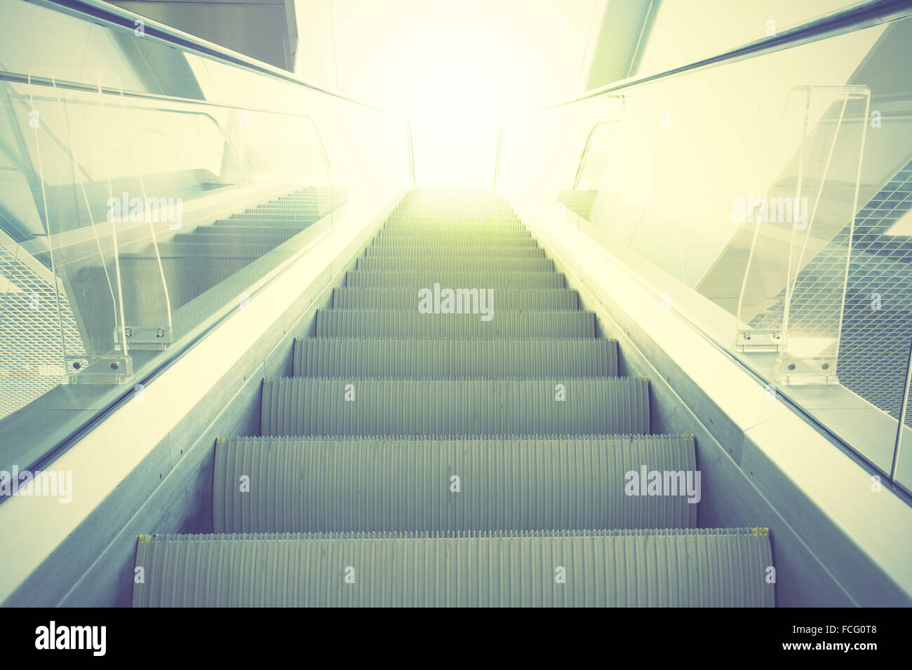 Escalator. Retro style filtred image Stock Photo