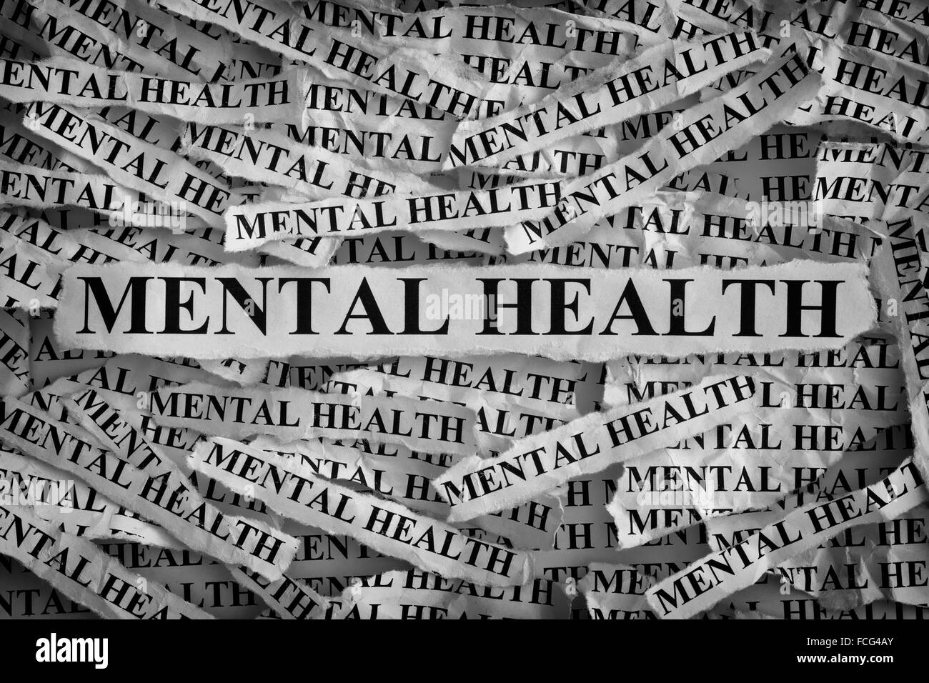 Mental health. Torn pieces of paper with the words Mental health