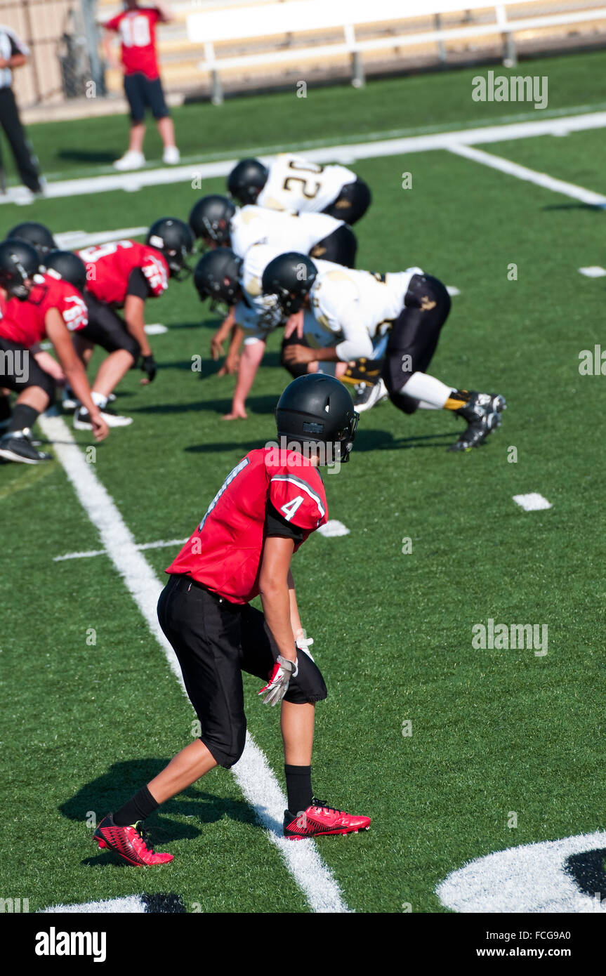 Young high school football player getting ready to go out for a pass on the field. Stock Photo