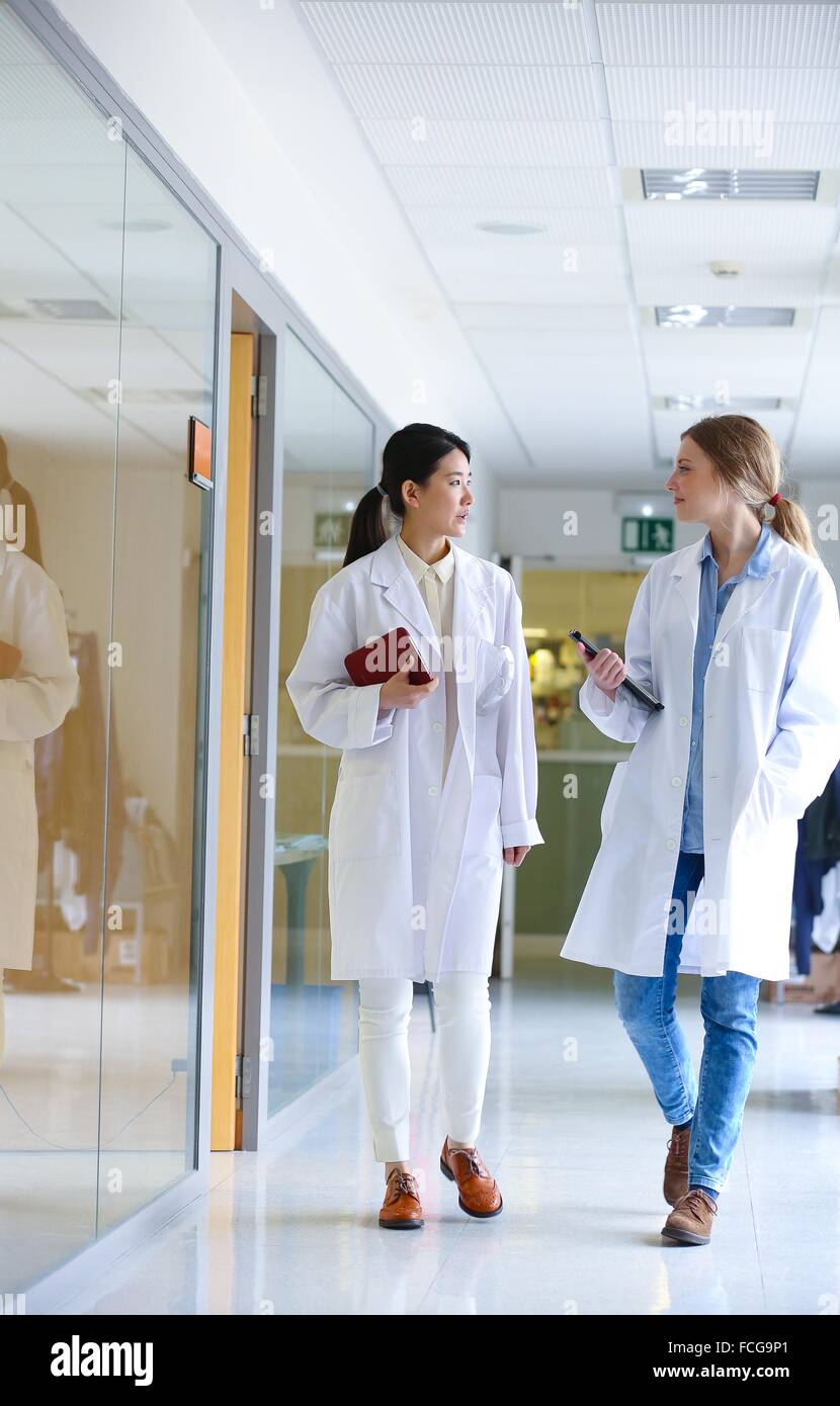 Researchers walking in hallway laboratory. Chemical Analysis Laboratory