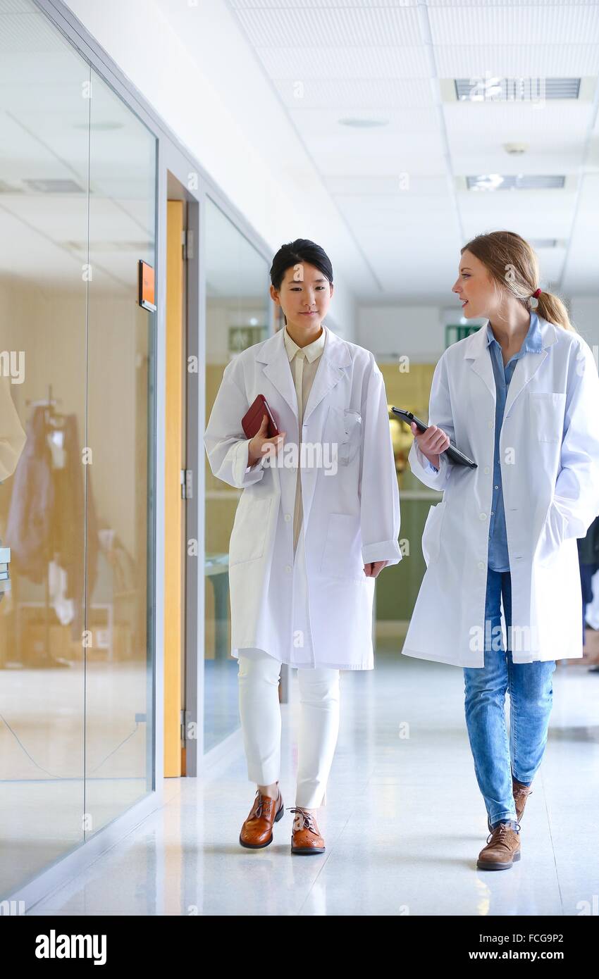 Researchers walking in hallway laboratory. Chemical Analysis Laboratory