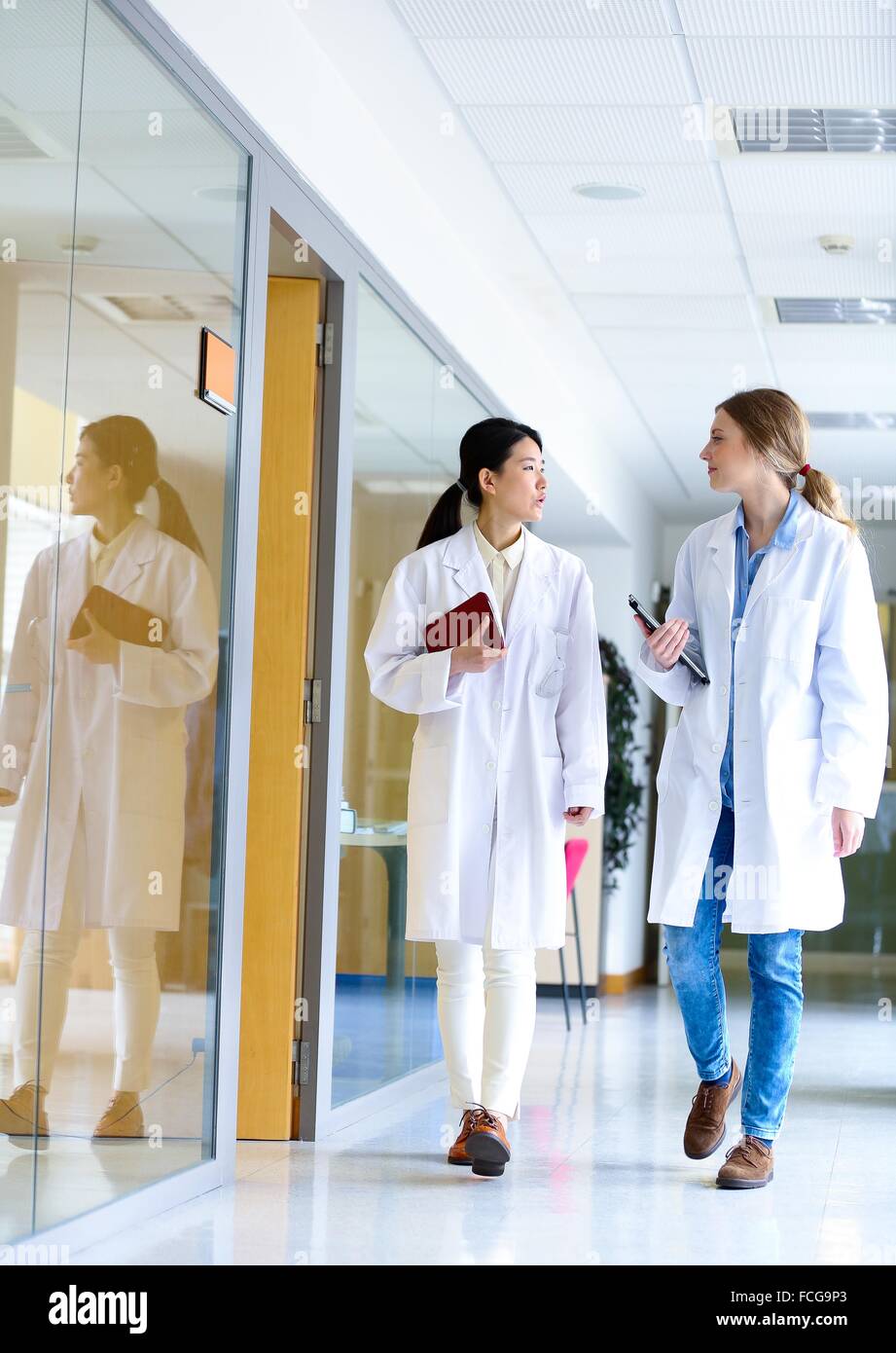 Researchers walking in hallway laboratory. Chemical Analysis Laboratory