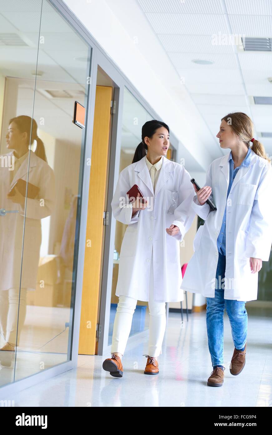 Researchers walking in hallway laboratory. Chemical Analysis Laboratory