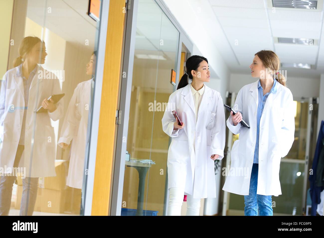 Researchers walking in hallway laboratory. Chemical Analysis Laboratory