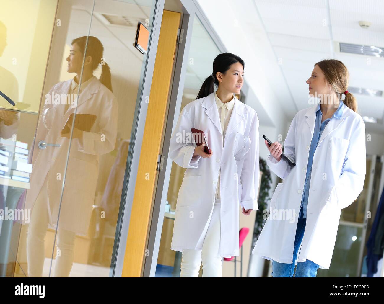 Researchers walking in hallway laboratory. Chemical Analysis Laboratory