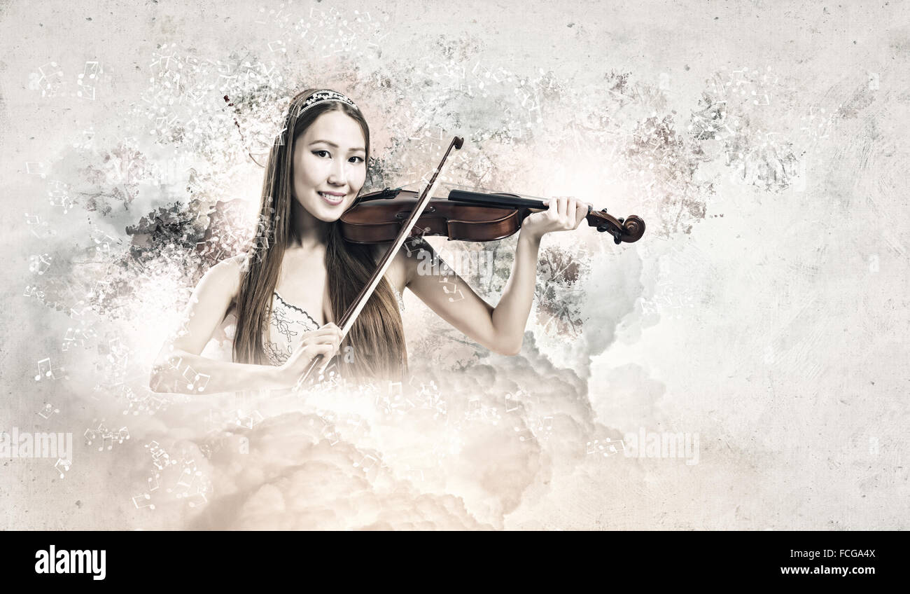 Young pretty asian woman playing violin. Young talent Stock Photo - Alamy