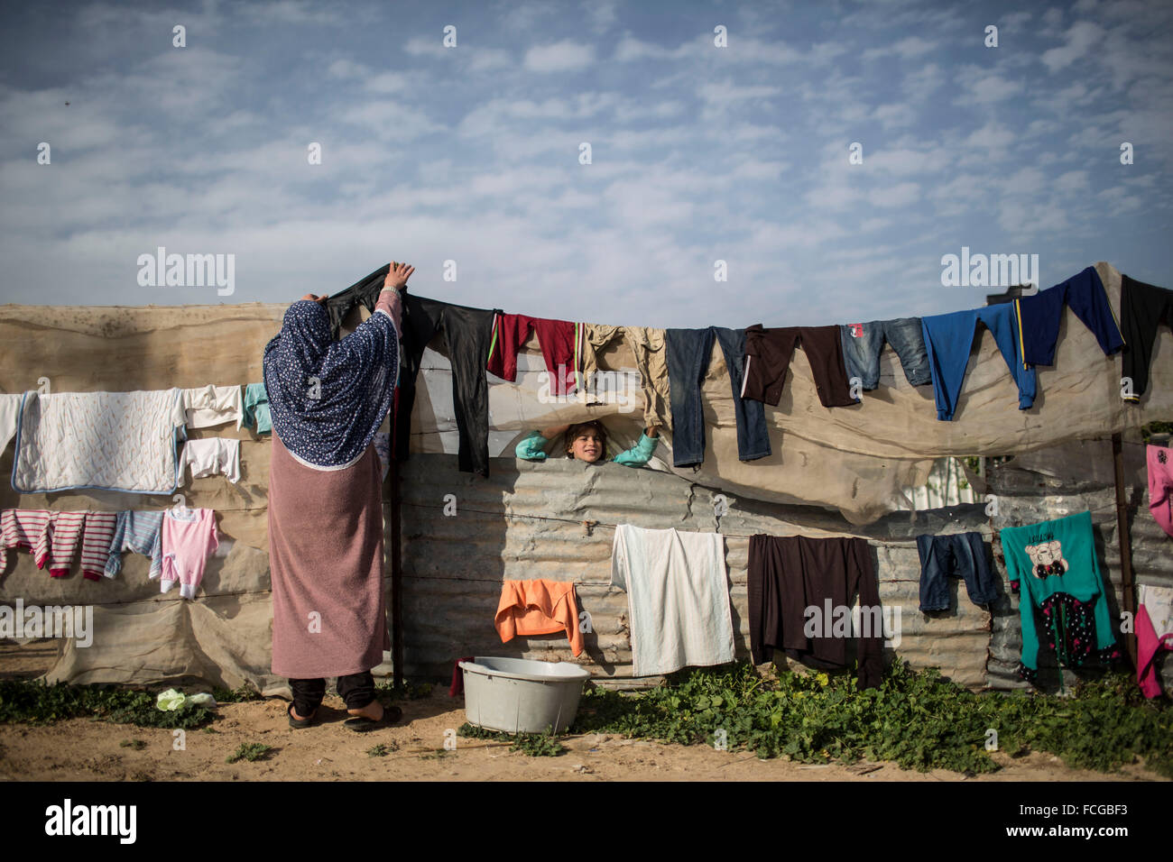 Gaza, Gaza Strip. 22nd Jan, 2016. A Palestinian girl peeks out through ...