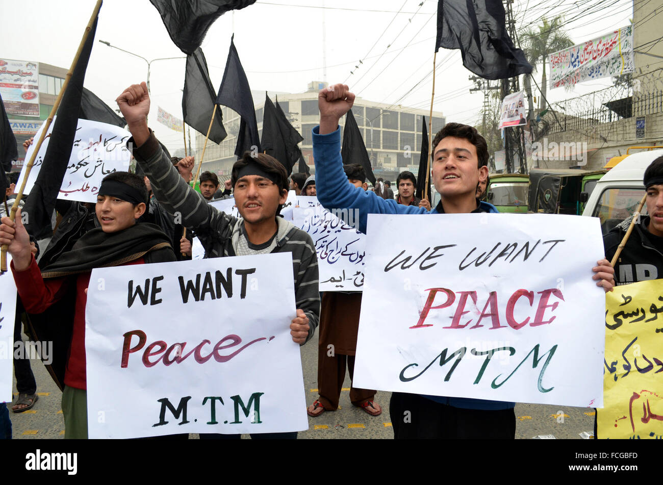 Lahore, Pakistan's Lahore. 22nd Jan, 2016. Pakistani young men hold placards as they protest against the militants attack on Bacha Khan University, in eastern Pakistan's Lahore, on Jan. 22, 2016. At least 21 were killed in the deadly attack on Bacha Khan University in Charsadda district. Credit:  Jamil Ahmed/Xinhua/Alamy Live News Stock Photo