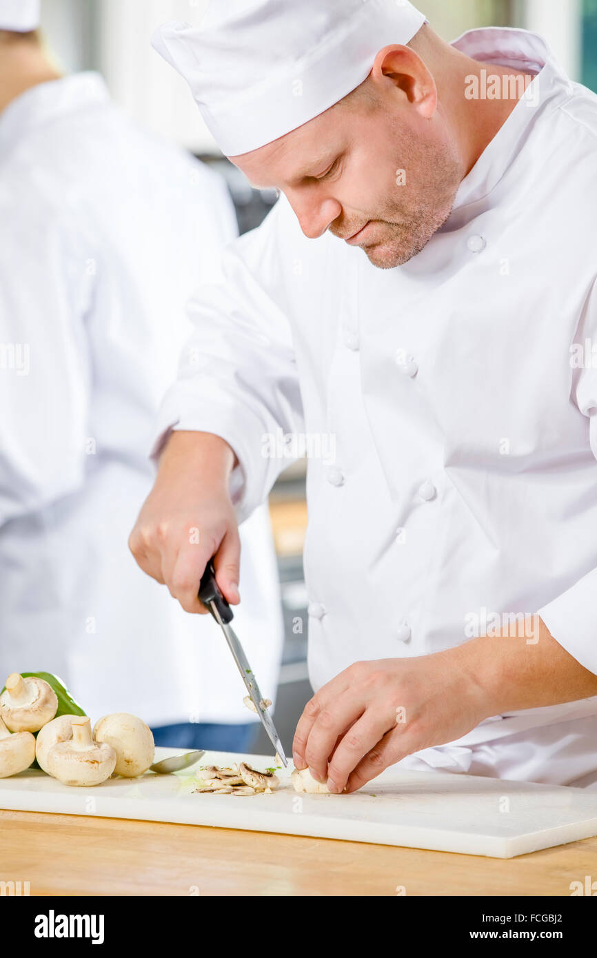 Professional chefs preparing vegetables in kitchen Stock Photo Alamy